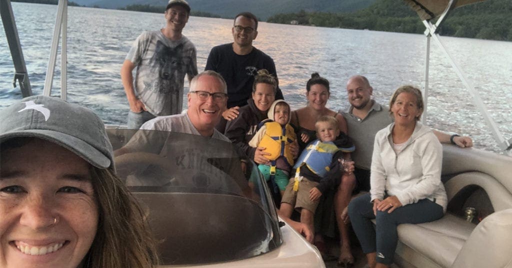 The Lucey Family in a boat on Lake George, New York after family camping trip tradition reimagined