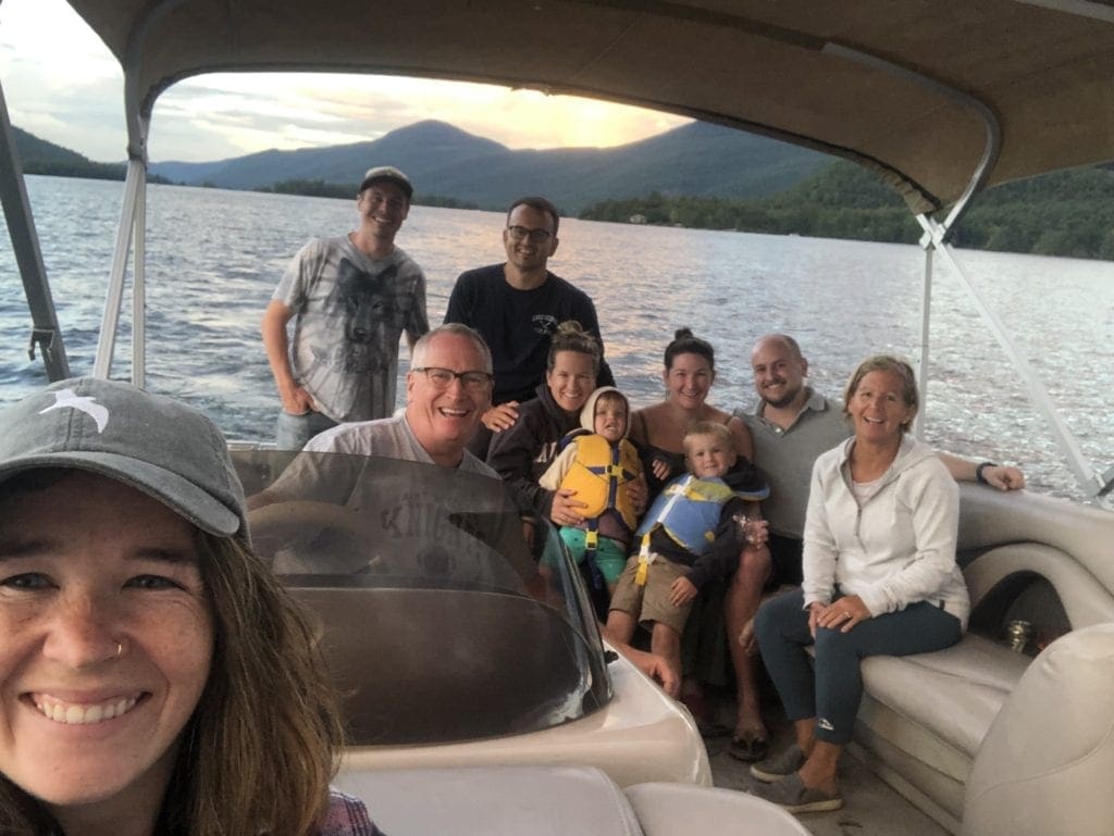 50th Year of a Family Camping Trip Tradition Reimagined 8 The Lucey Family in a boat on Lake George, New York after family camping trip tradition reimagined