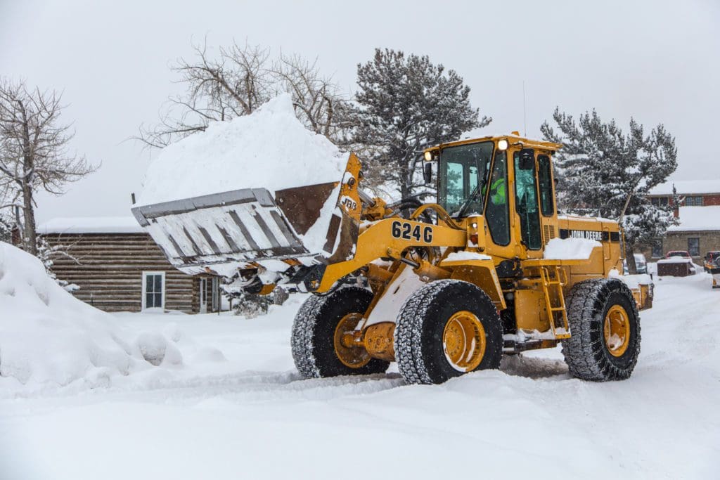 Winter in the Parks 9 A front loader has a bucket full of snow