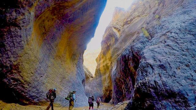 March 2021 - Park of the Month 27 Backpackers explore the dark scenic passageway of Marble Canyon